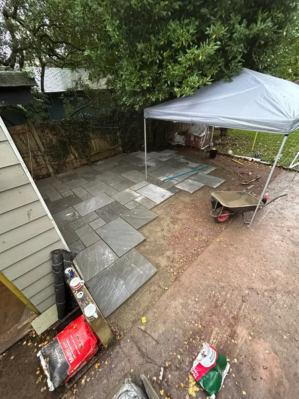 Silver-grey sandstone patio laying underway