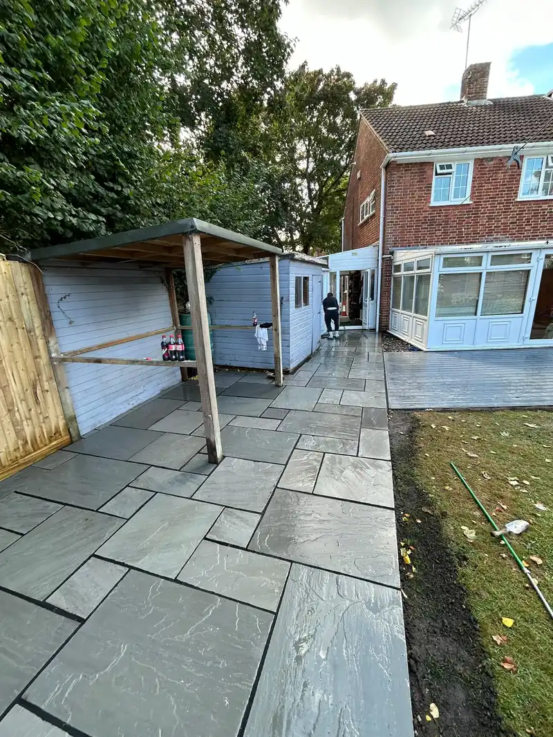 Completed grey sandstone patio and timber decking