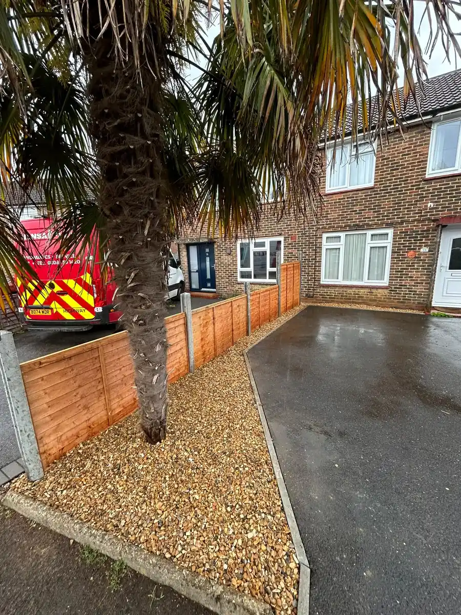 Front garden gravel landscaping and timber fence