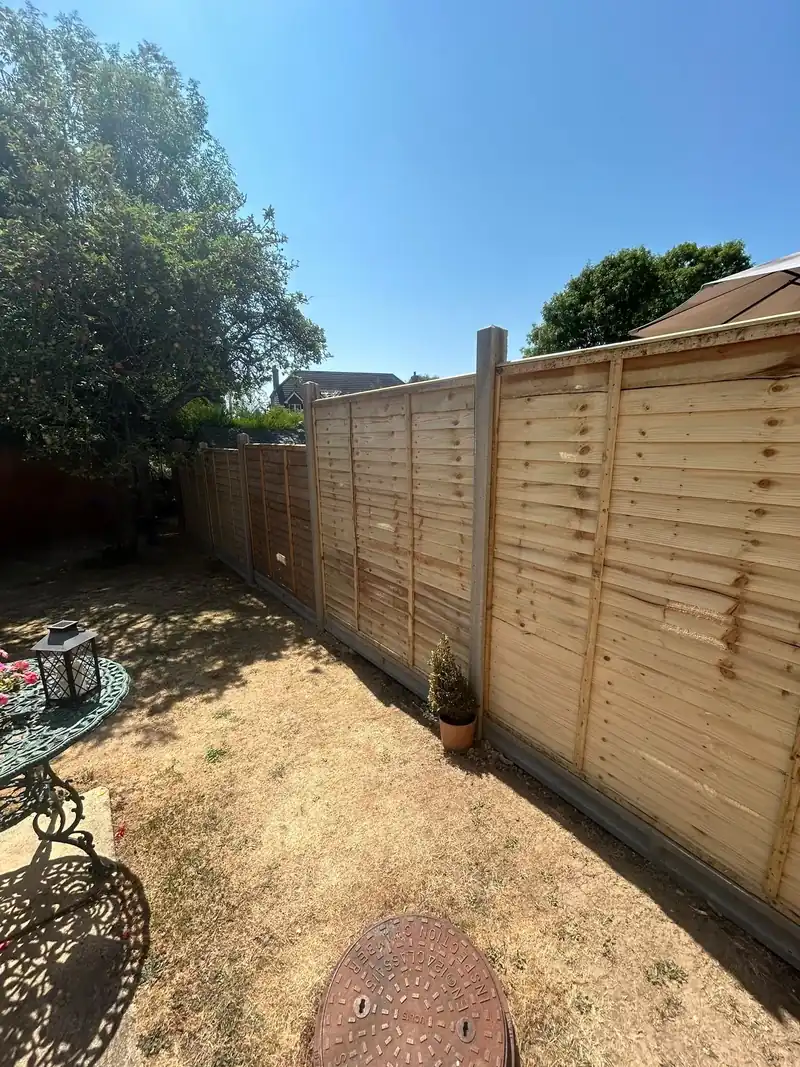 Newly installed closeboard timber garden fence