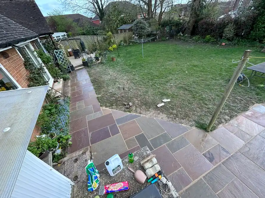 Sandstone patio and garden lawn overview