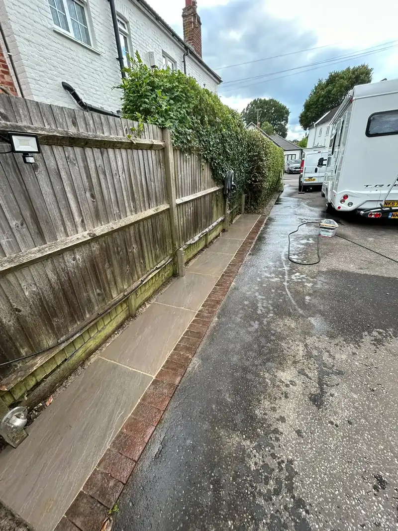 Sandstone side path finished with brick edging