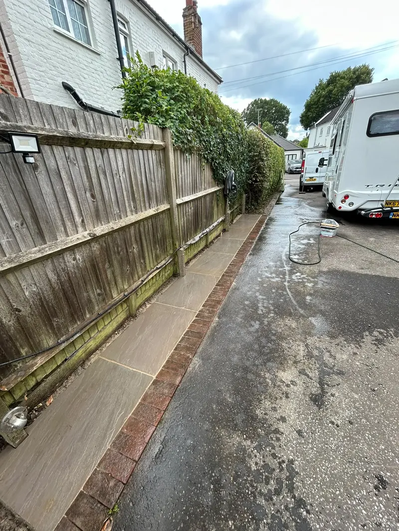 Rebuilt side passage with new sandstone path and brick edging