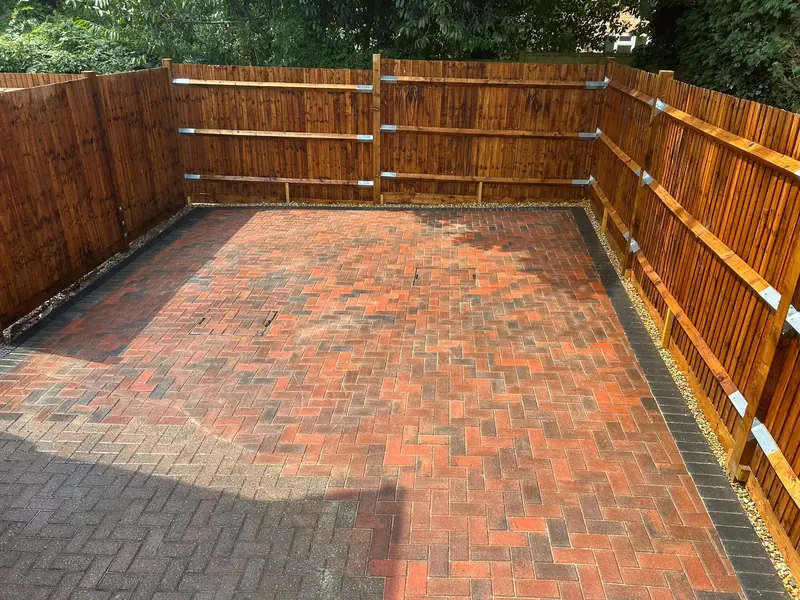 Block paved driveway with timber fencing